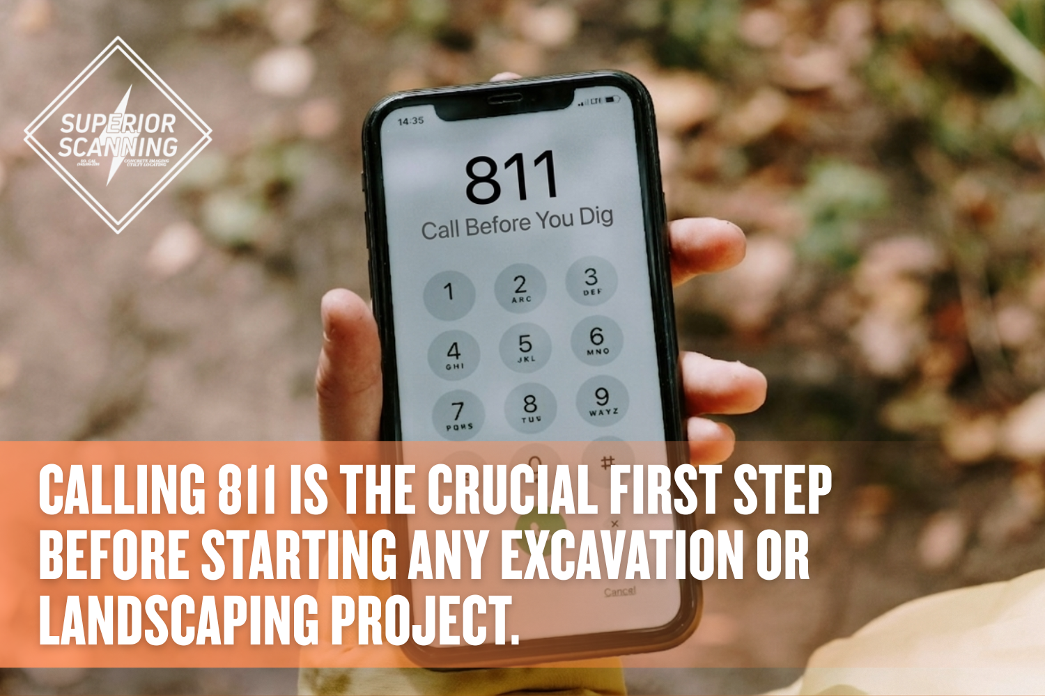 A close-up of a person holding a smartphone outdoors, with the national "Call Before You Dig" number, 811, dialed on the screen's keypad.