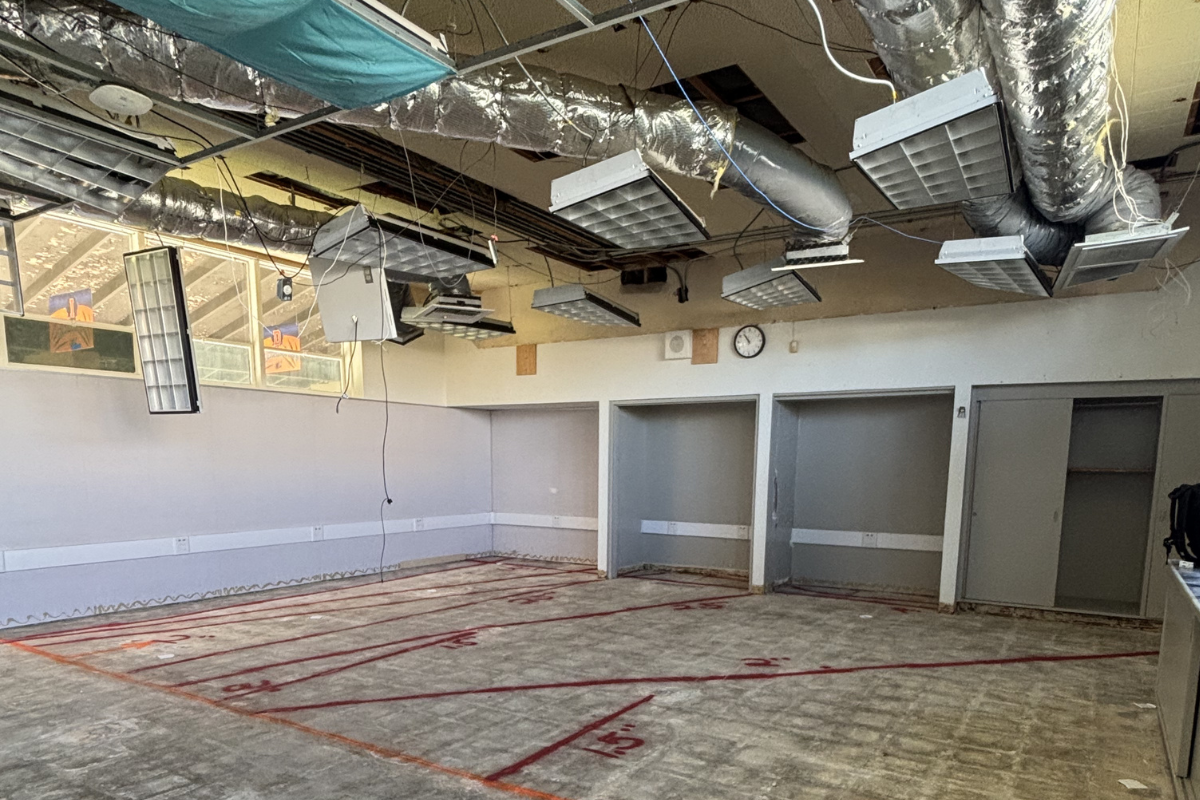 Cedars-Sinai Medical Center interior renovation with exposed ceiling ductwork, electrical wiring, and concrete floor markings for GPR scanning and utility layout.