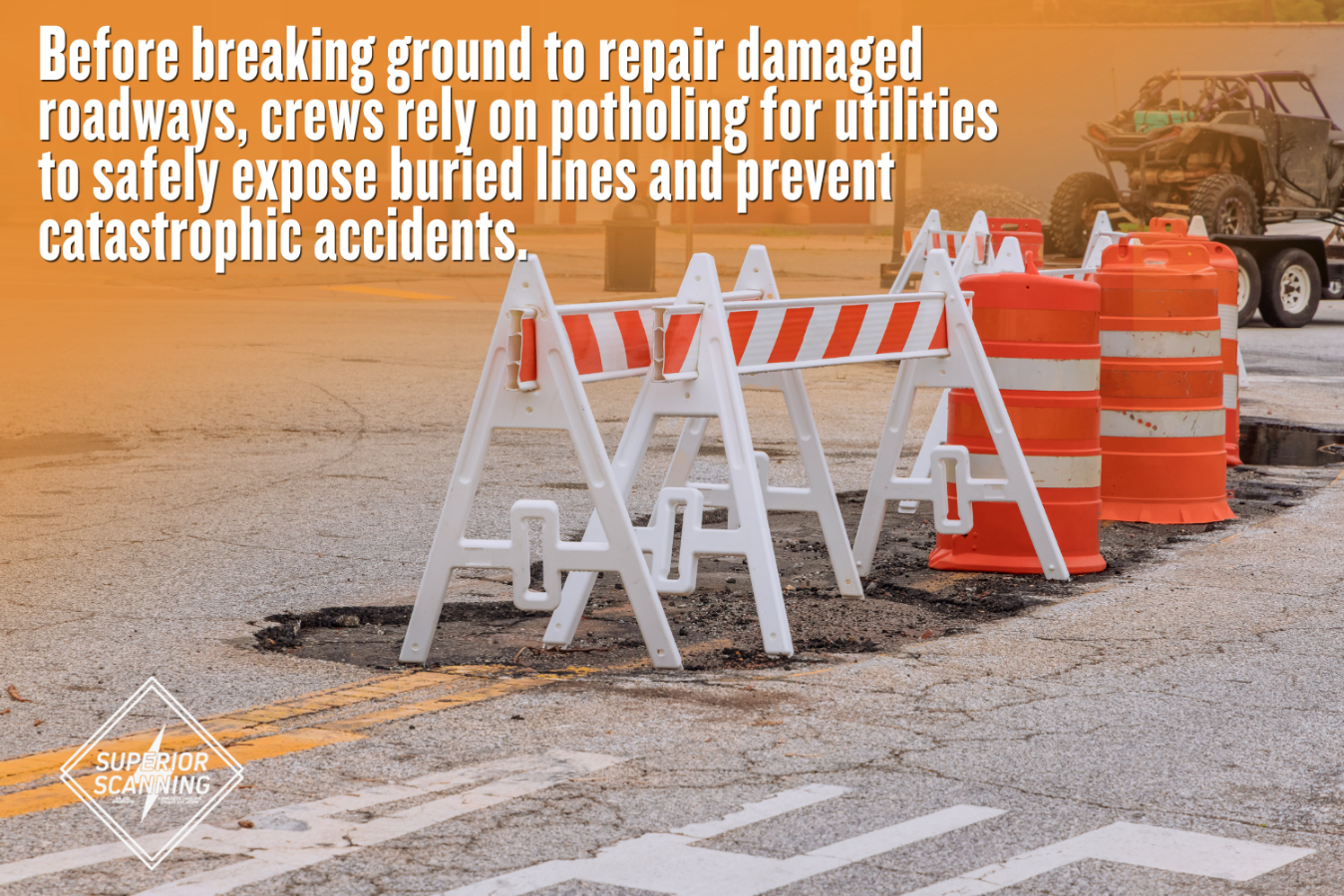 A close-up, high-angle photograph focusing on a deep pothole in asphalt pavement, surrounded by a yellow wooden barricade, two bright orange traffic cones, and a horizontal cross-beam barrier with red and white striped reflective tape.