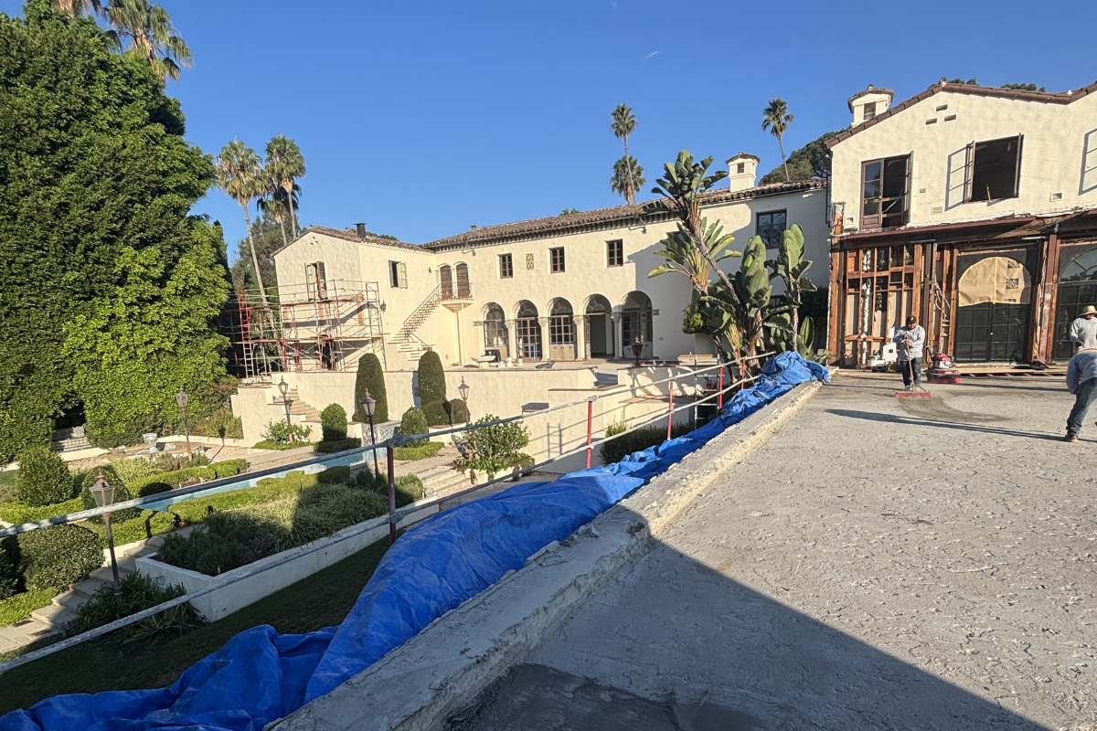 Concrete scanning and renovation of the Beverly House with scaffolding, workers, and GPR safety measures in Southern California.