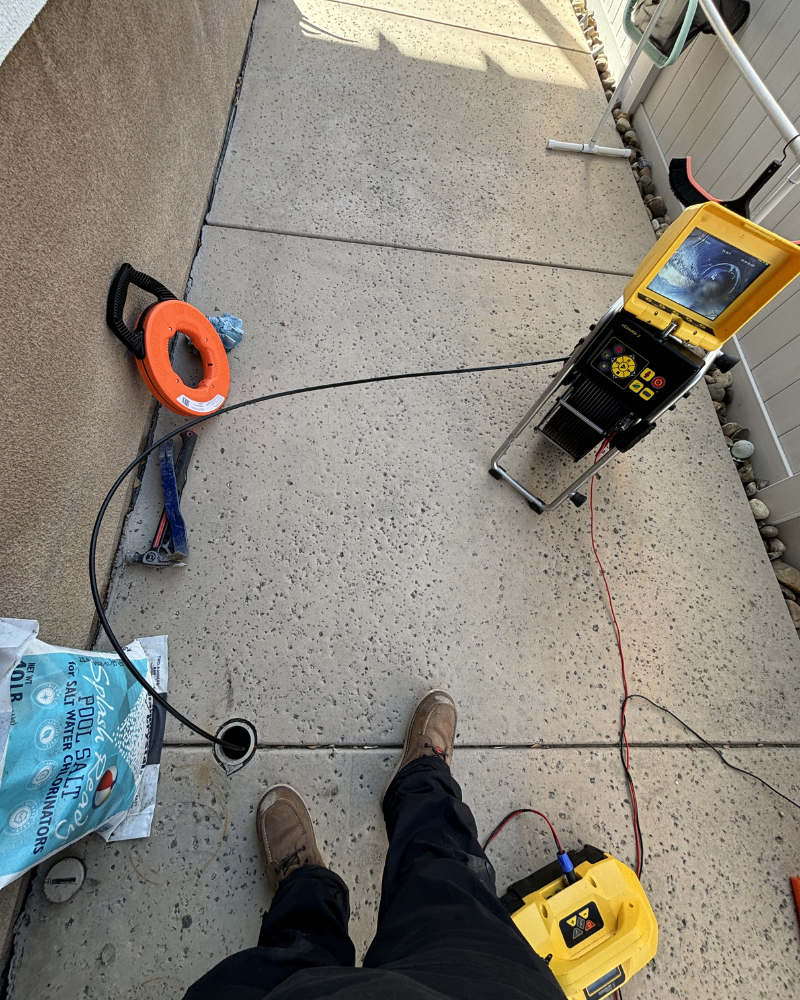 Utility locating and pipe inspection with camera system and cable reel for concrete scanning and plumbing diagnostics in Southern California.
