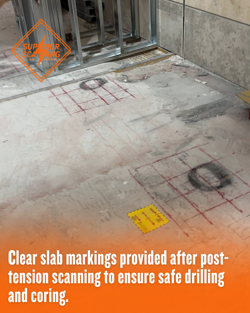 Red grid lines and black circles marked on a commercial concrete slab, demonstrating the clear results of scanning for post tension cables to identify safe core drilling locations.
