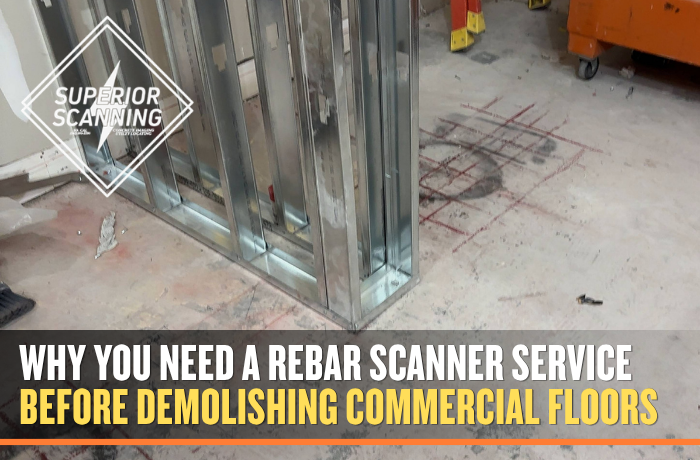 Rebar scanner service markings on a commercial concrete floor before demolition