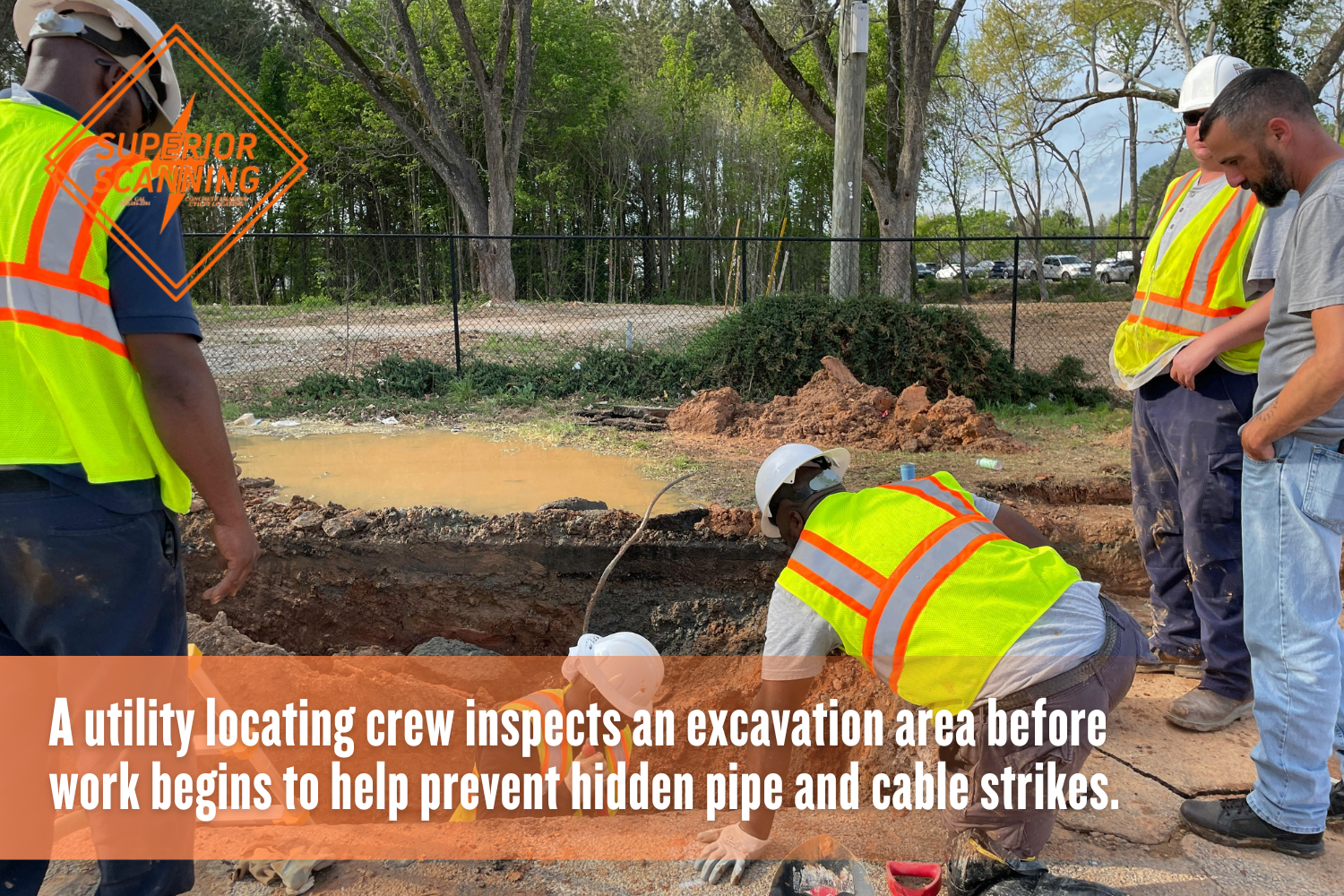 Utility locating services crew checking a dig site for buried utilities.