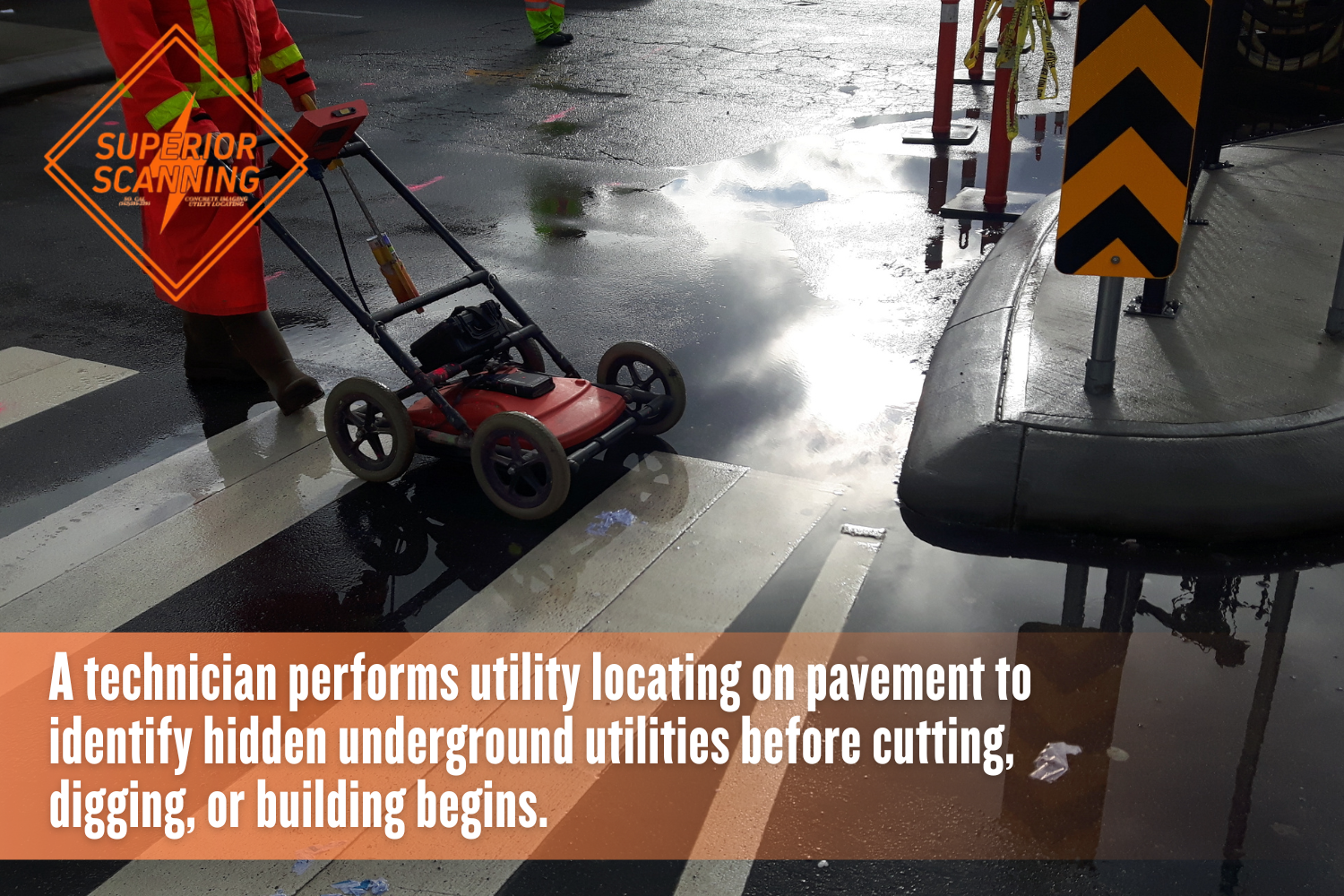 Utility locating technician scanning pavement for underground utilities.