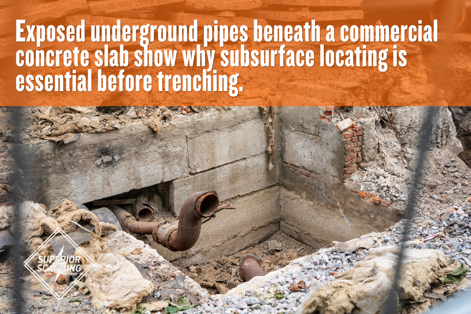 Exposed underground plumbing pipes beneath a damaged commercial concrete slab before trenching