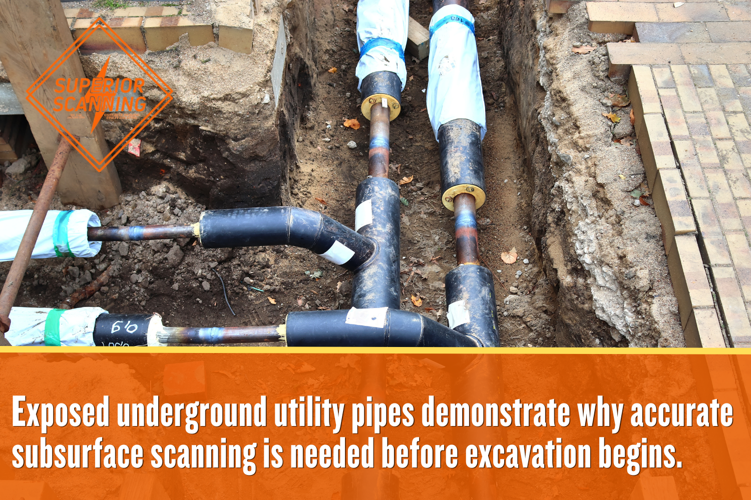 Exposed underground utility pipes and connections in an open construction trench