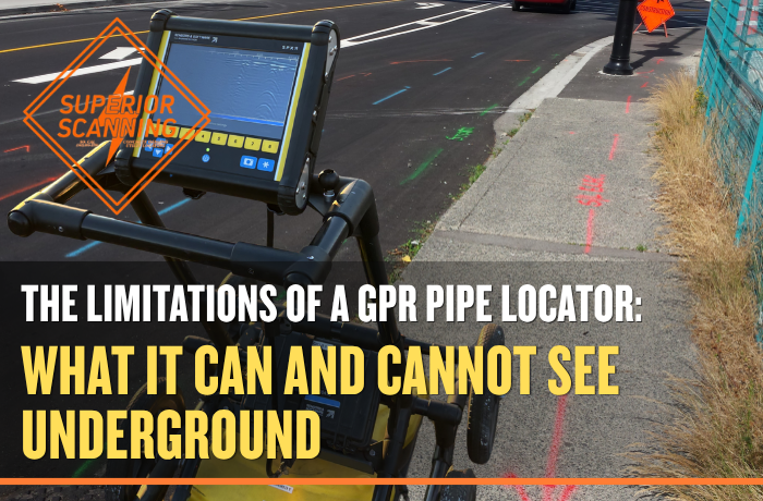 Ground-penetrating radar equipment positioned beside marked utility lines on a paved street and sidewalk.