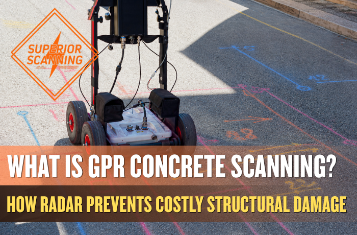 Ground penetrating radar cart scanning pavement with painted utility line markings before construction coring or excavation.
