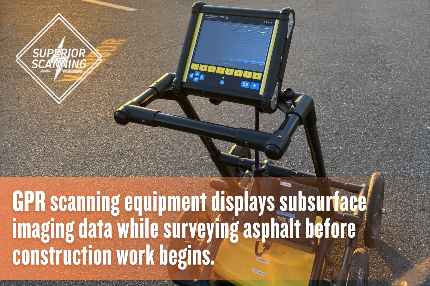 Ground penetrating radar scanner showing subsurface imaging data during a GPR scan on asphalt.